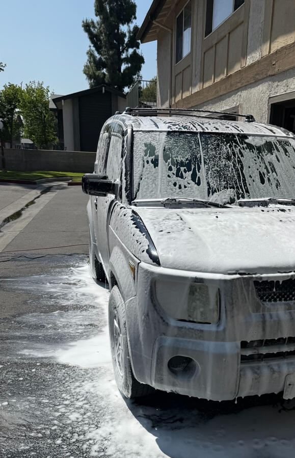 Honda Element covered in foam during an exterior wash